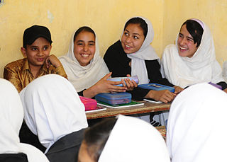 Islamic students smiling in classroom, public domain
